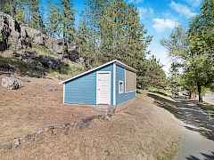 Outbuilding has been used as a greenhouse or a chicken coop Outbuilding has been used as a greenhouse or a chicken coop