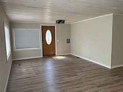 Main entrance to living room. Room darkening honeycomb shades on west side of home Main entrance to living room. Room darkening honeycomb shades on west side of home