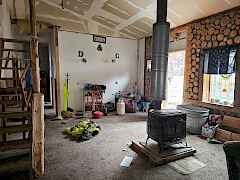 Living room and stairs to cubby upstairs Living room and stairs to cubby upstairs
