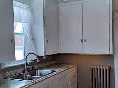 original cabinets with countertop and sink upgrade.